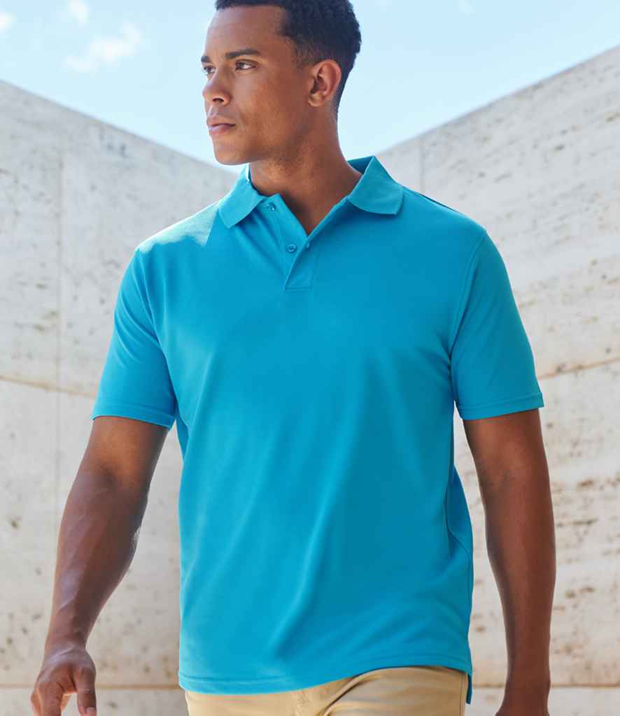 Man wearing bright blue polo shirt, ideal for custom clothing printing and embroidered workwear in Coventry