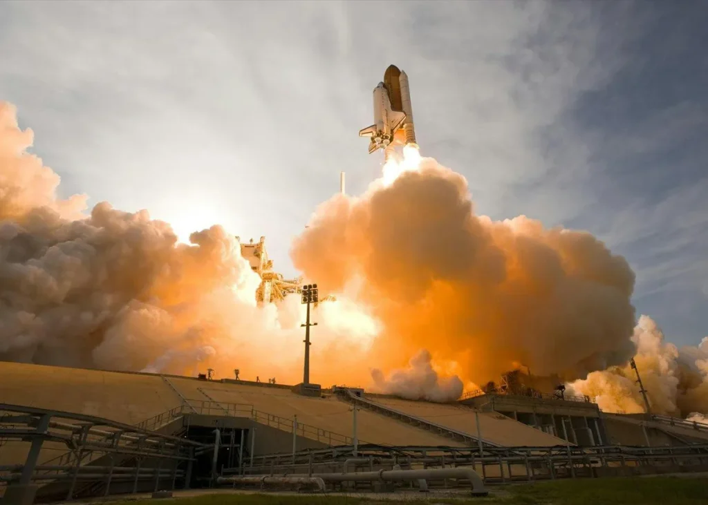 Rocket launching into the sky, symbolising decisive action and momentum when rethinking business strategy